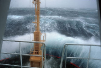 Crossing Drake's Passage. Waves crashing over the bow of the RRS Ernest Shackleton during a Force 12 storm.