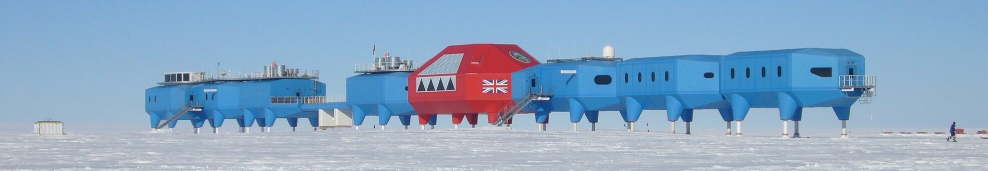 Landscape image of Halley VI station in the background, and the brunt ice-shelf in the foreground.