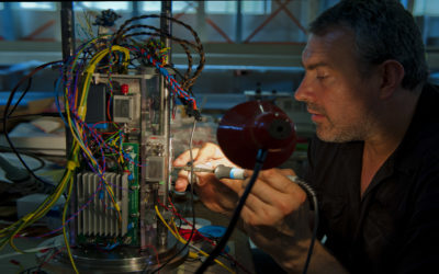 A man working on electronic equipment