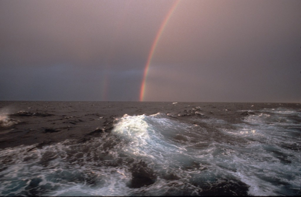 Rainbow seen on a stormy day at sea