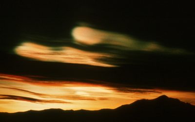 Nacreous (also known as mother of pearl or stratospheric) clouds. These clouds form at around 20km altitude in the ozone layer and are instrumental in the process of ozone depletion. Because of their altitude they remain illuminated by the sun, long after sunset on the ground.