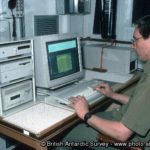 A man sitting in front of a computer.