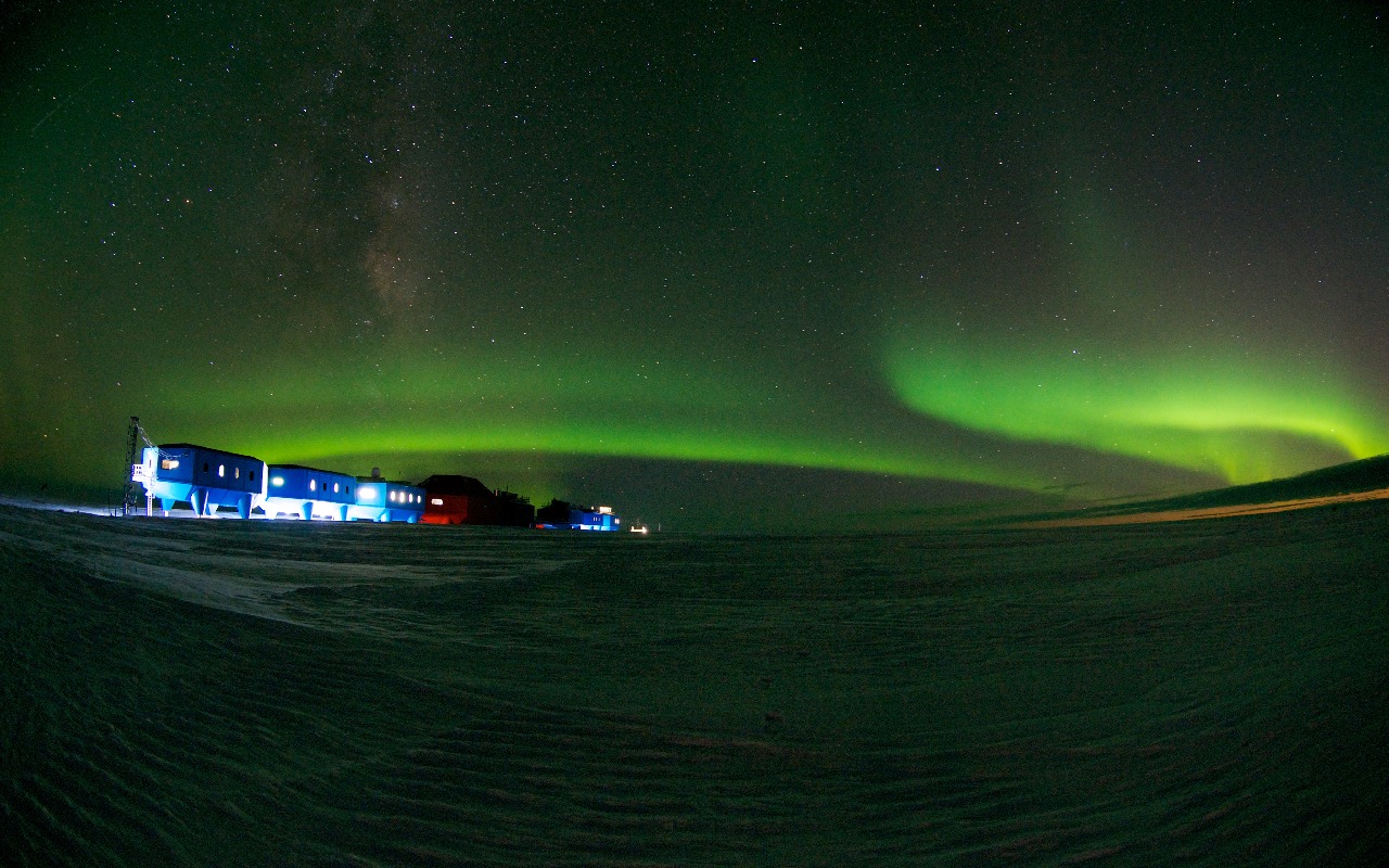 Winter image of the Halley VI Research Station on the Brunt Ice Shelf in Antarctica with aurora