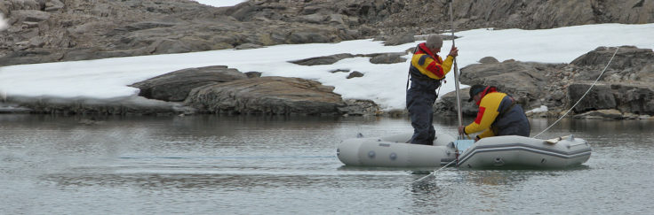 BAS scientists extracting a sediment core from a remote lake on Horseshoe Island, Antarctic Peninsula. The climate record in this core will cover approx' 20,000 years.