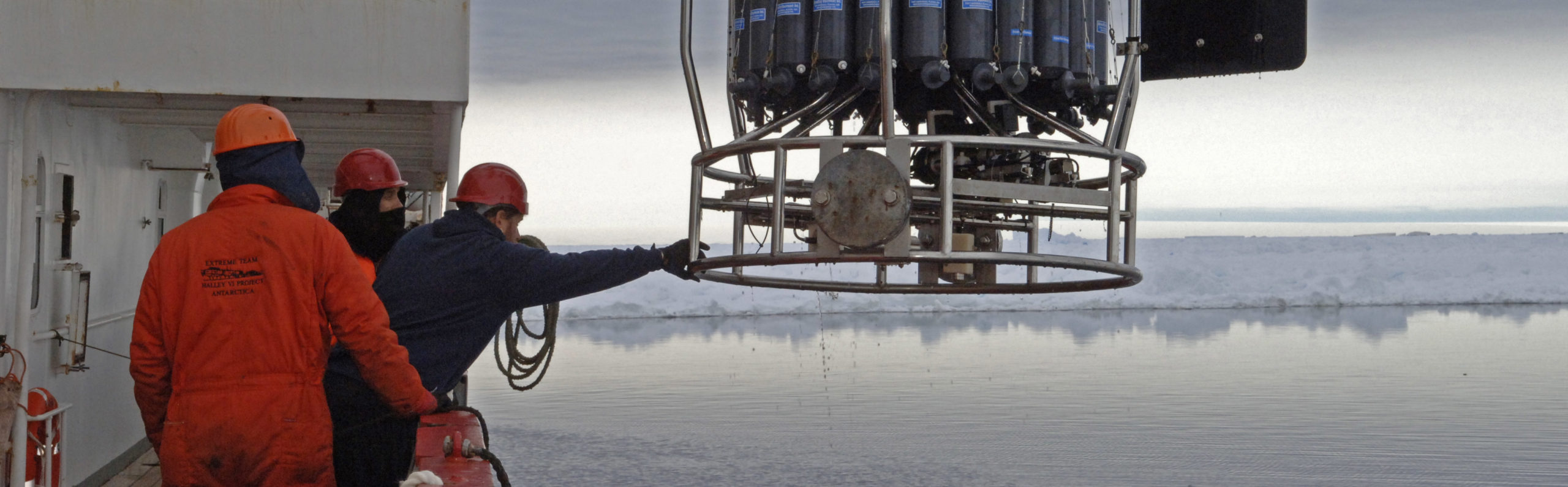 A man standing next to a boat.