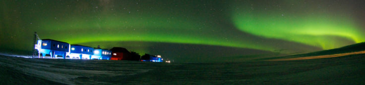 Winter image of the Halley VI Research Station on the Brunt Ice Shelf in Antarctica with aurora