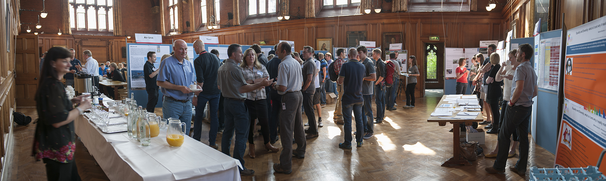 A group of people standing around a table.