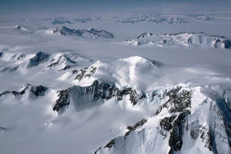 Mountains and glaciers of the Antarctic Peninsula from the air.