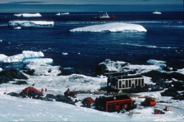 Three base T buildings, ice floes, and Bransfield offshore, 1971. (Photographer: Charles Swithinbank; Archives ref: AD19/3/C/T27)
