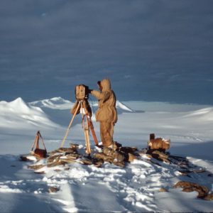 A group of people that are standing in the snow.