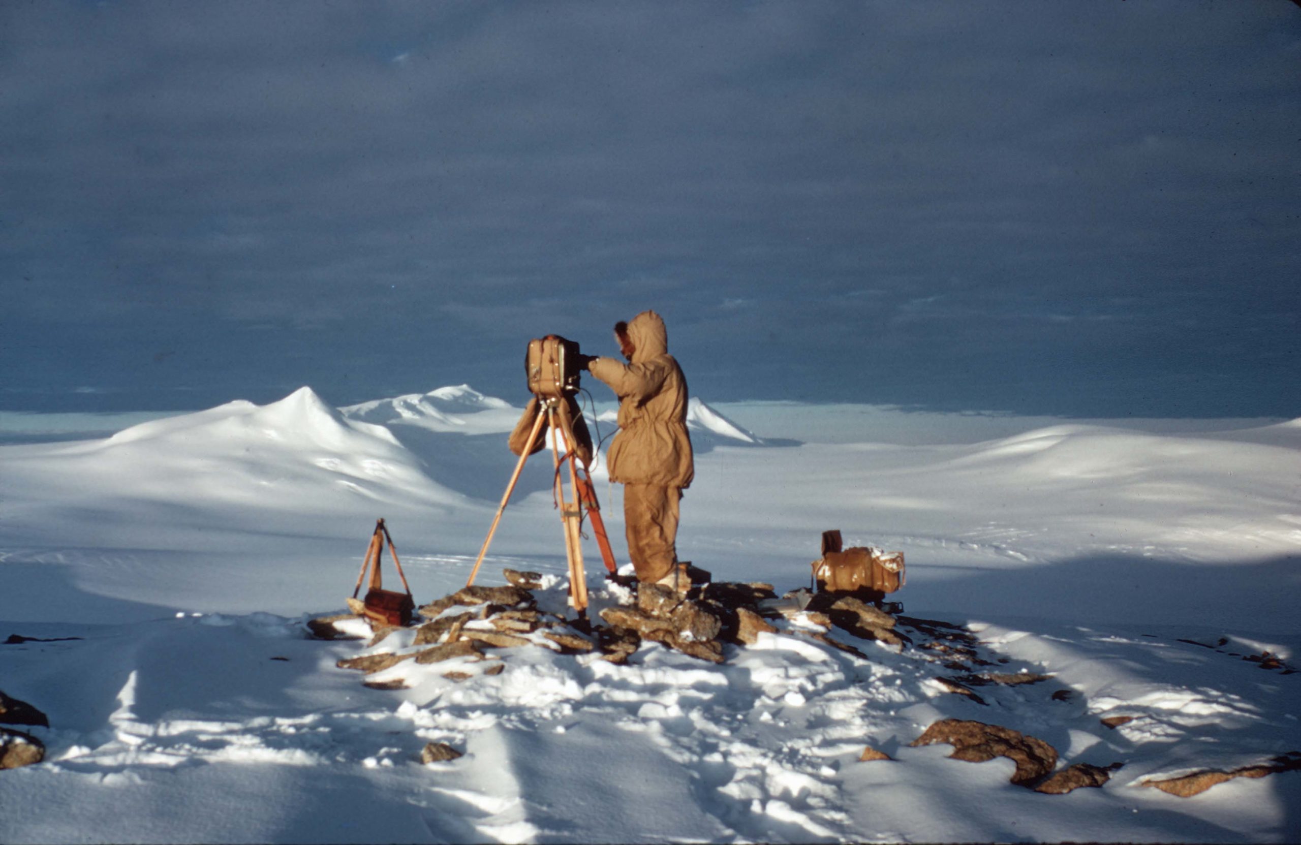 A group of people that are standing in the snow.