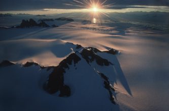 Evening light: Looking from above the Antarctic Peninsula over George VI Sound towards Alexander Island.