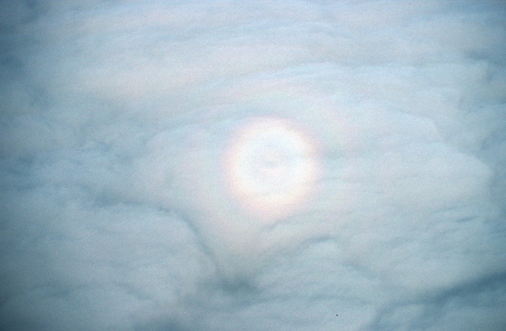 Atmospheric effects on the clouds seen from an aircraft flying above them.