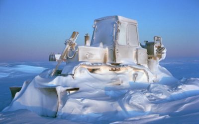 The reality of winter at Halley research station where temperatures may drop below -50 degrees Celsius. An International Harvester Bulldozer is encased in a frost of spin-drift and drifted snow through the winter of 1995. Once the bulldozer's engine preheaters are switched on, the vehicle could be running in an hour.
