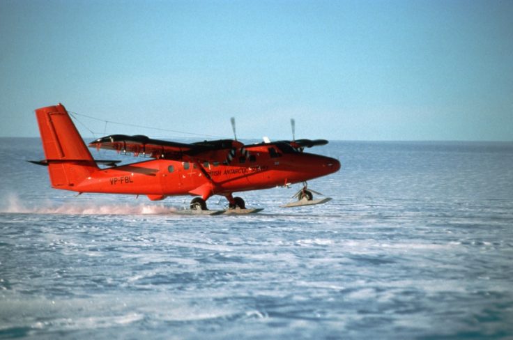 A small plane sitting on top of a body of water.