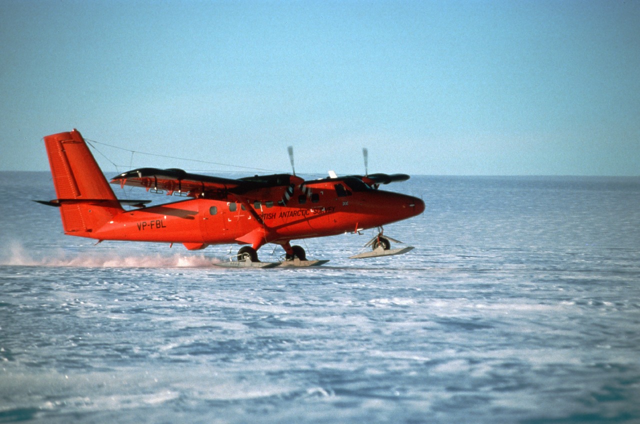 A small plane sitting on top of a body of water.