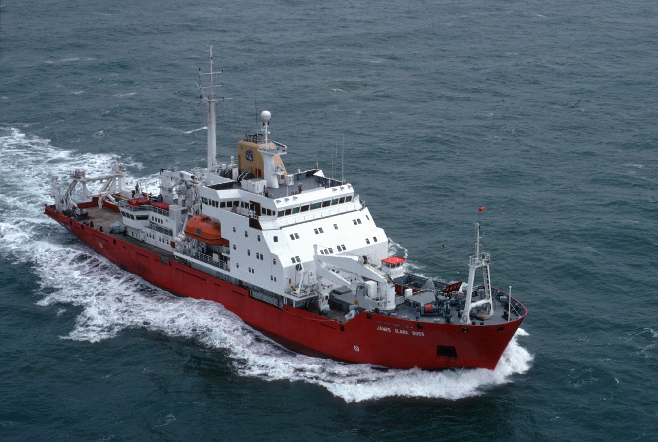 A small boat in a large body of water.