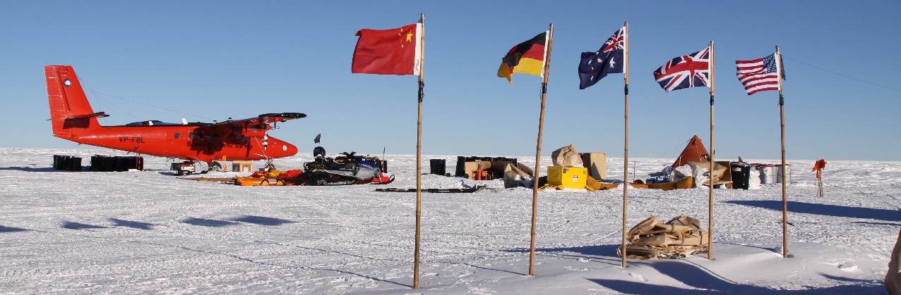 A group of people sitting in the snow.