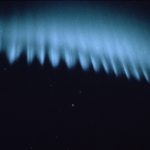 A person in a dark room.