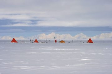 A airplane that is covered in snow.