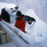 A man that is standing in the snow.