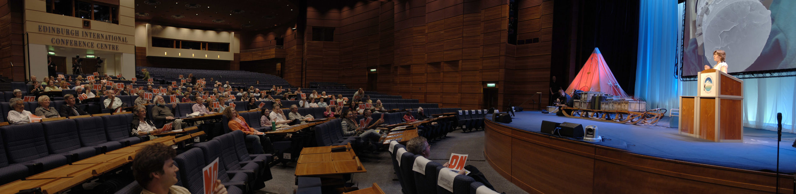 People watching a lecture in a theatre