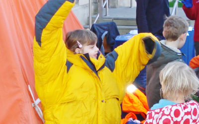 A group of people standing next to a child.