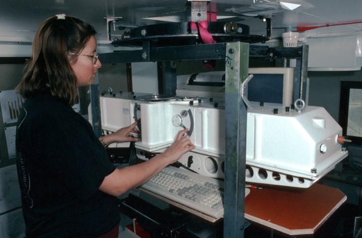 A person cooking in a kitchen.