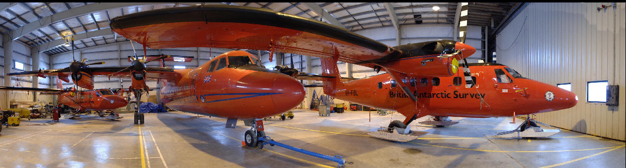 Orange aircraft in a hanger