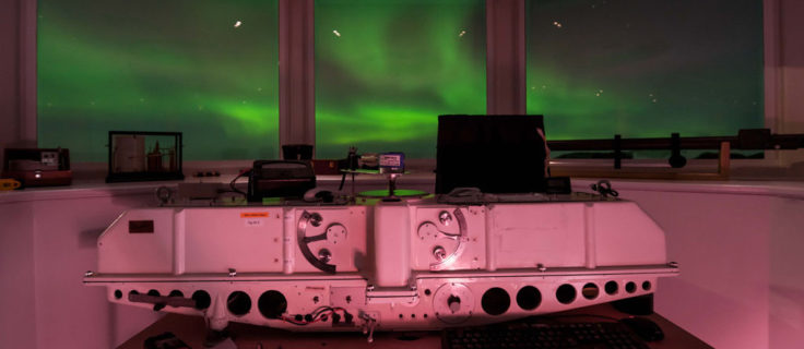 The Dobson Ozone Spectrophotometer used to measure ozone from the ground at Halley VI Research Station with the impressive Aurora Australis display in the background. (Photo: Tom Welsh)