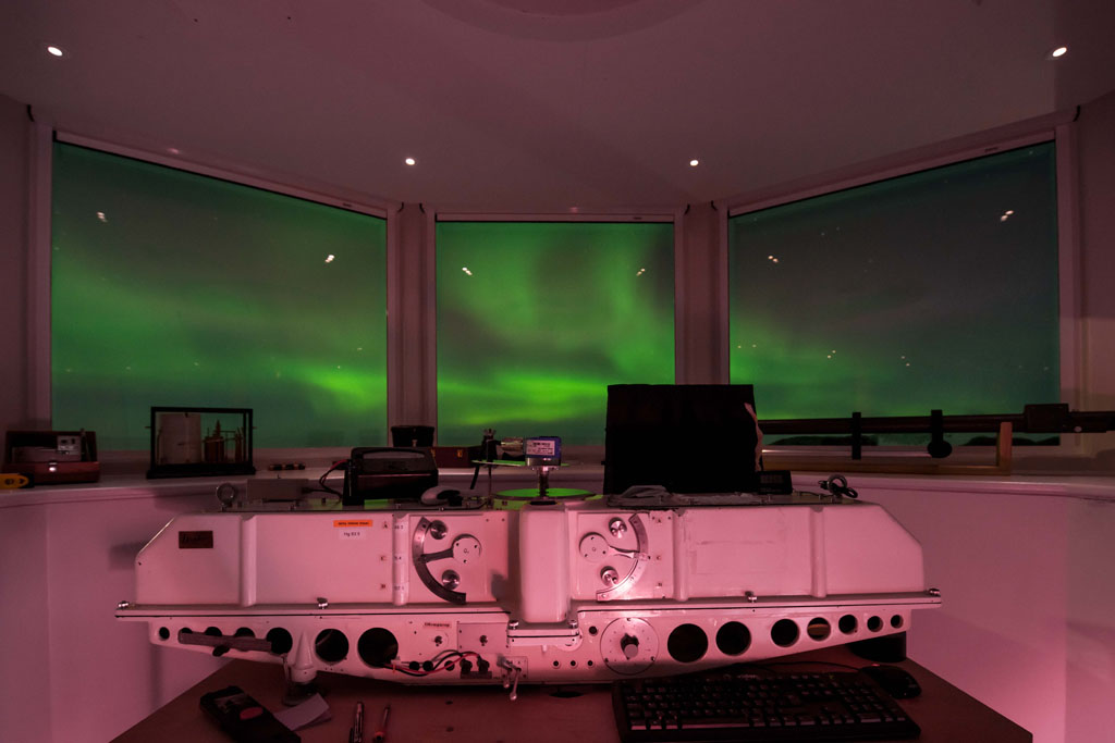 The Dobson Ozone Spectrophotometer used to measure ozone from the ground at Halley VI Research Station with the impressive Aurora Australis display in the background. (Photo: Tom Welsh)