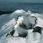 A close up of a snow covered mountain.
