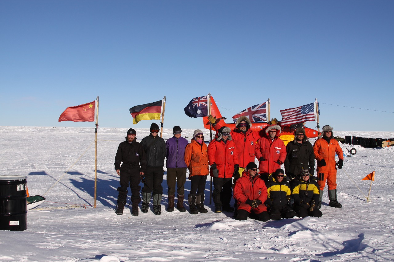 A group of people that are standing in the snow.