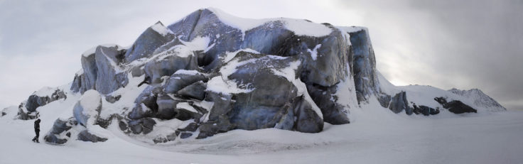 The black ice glacier front of the Comfortlessbreen Glacier on Svalbard