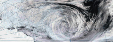 A close up of a snow covered slope.