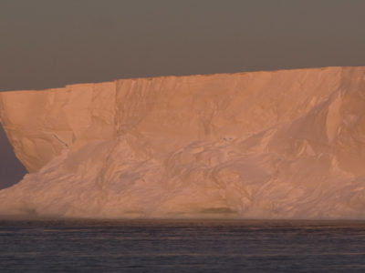 A close up of a snow covered mountain.