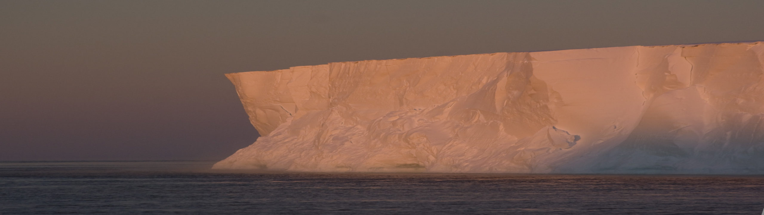 A close up of a snow covered mountain.