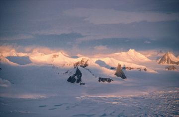A close up of a snow covered mountain.
