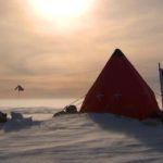 A BAS camp of small tents in an icy landscape