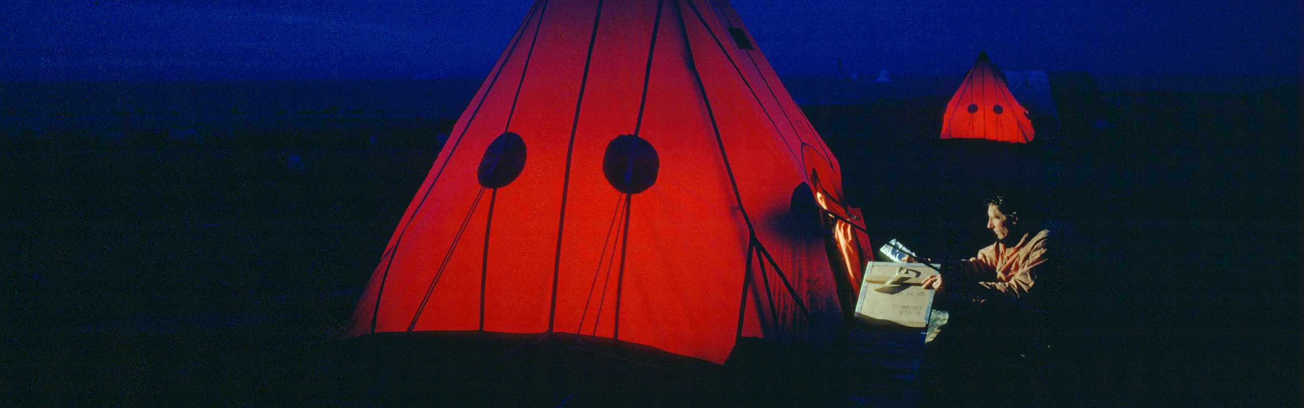 Orange tents in the dark