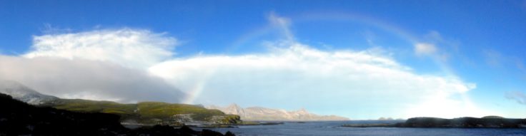 Rainbow over Main Bay on Bird Island with South Georgia in the background 