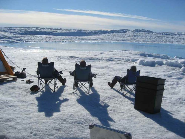 Working in the deep field, Petermann ice shelf, NW Greenland - scientists take a moment to enjoy the beauty of their surroundings