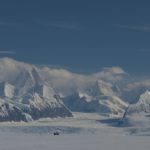 A close up of a snow covered mountain.