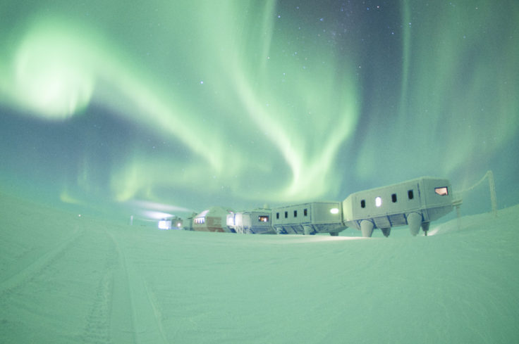Winter image of the Halley VI Research Station on the Brunt Ice Shelf in Antarctica with aurora
