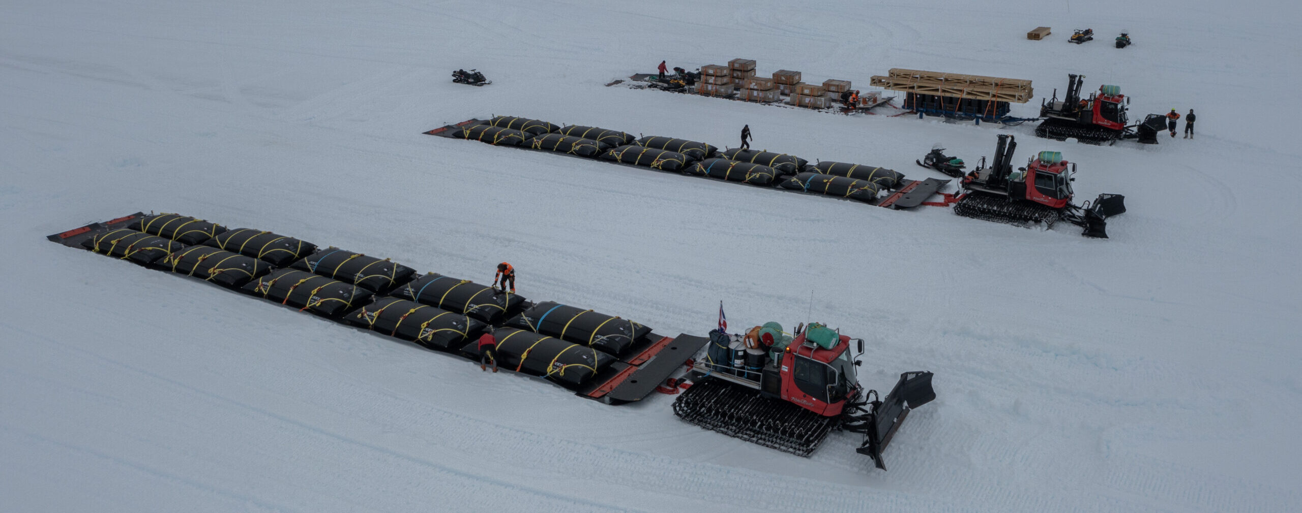 Traverse vehicles use poli-sledges to deliver bulk cargo and fuel for deep field science