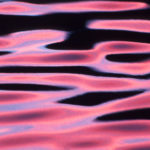 Colourful ripples on water