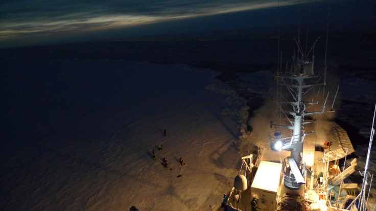 A large ship in the background.