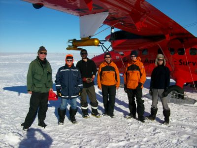 A group of people that are standing in the snow.