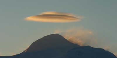 A view of a large mountain in the background.