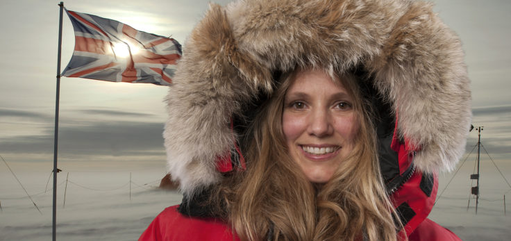 Emily shuckburgh wearing a hat and smiling at the camera.